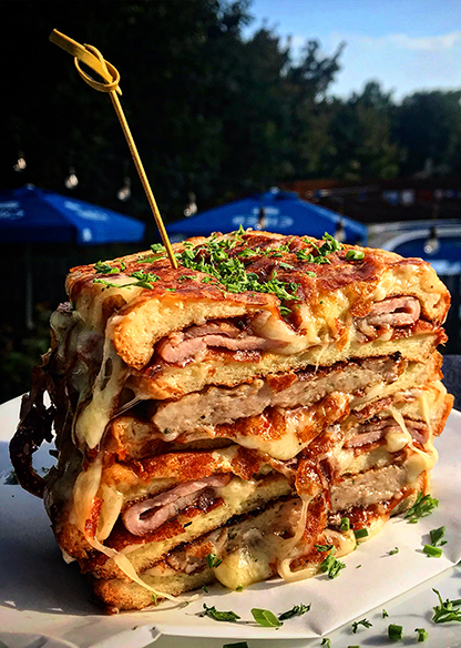 A Picture of The Breakfast Club Stack, with Bacon, Sausage and lots of Cheese